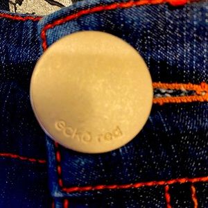 Ecko red size 5 women’s jeans with wide cuffs at the bottom. Gently used